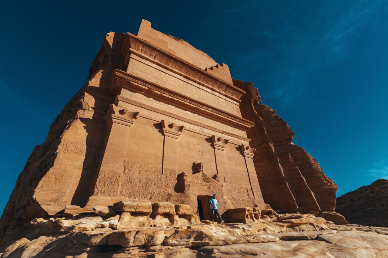 22-metre Nabataean tomb carved into sandstone cliff at Hegra, Saudi Arabia's first UNESCO World Heritage Site (inscribed 2008)