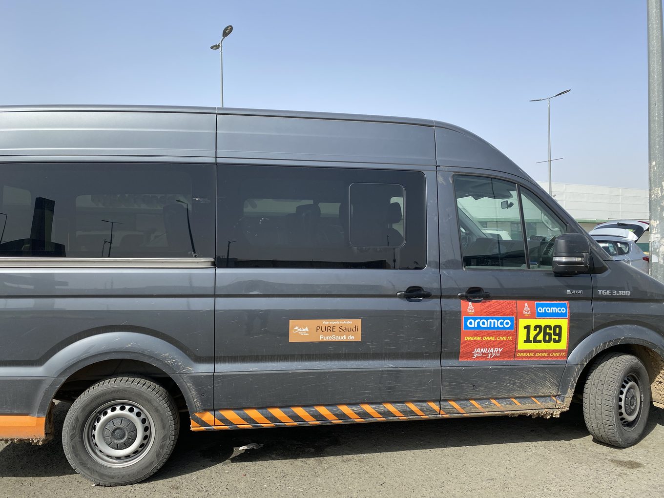 PURE Saudi by DISCOVERY tour van with Dakar race plates