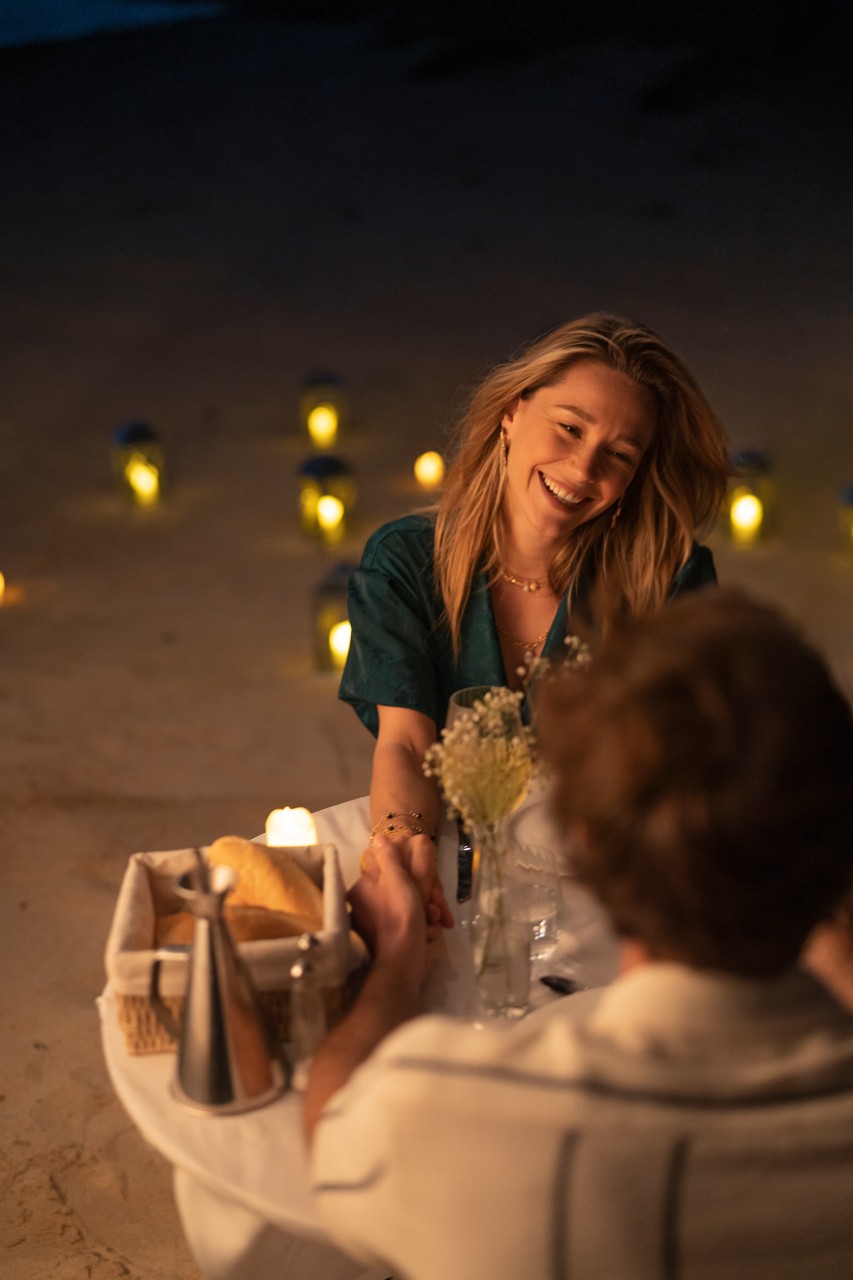 Romantic candlelit dinner on the beach