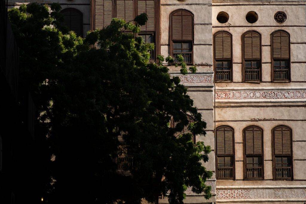 Restored coral-stone house in Al-Balad with wooden balconies
