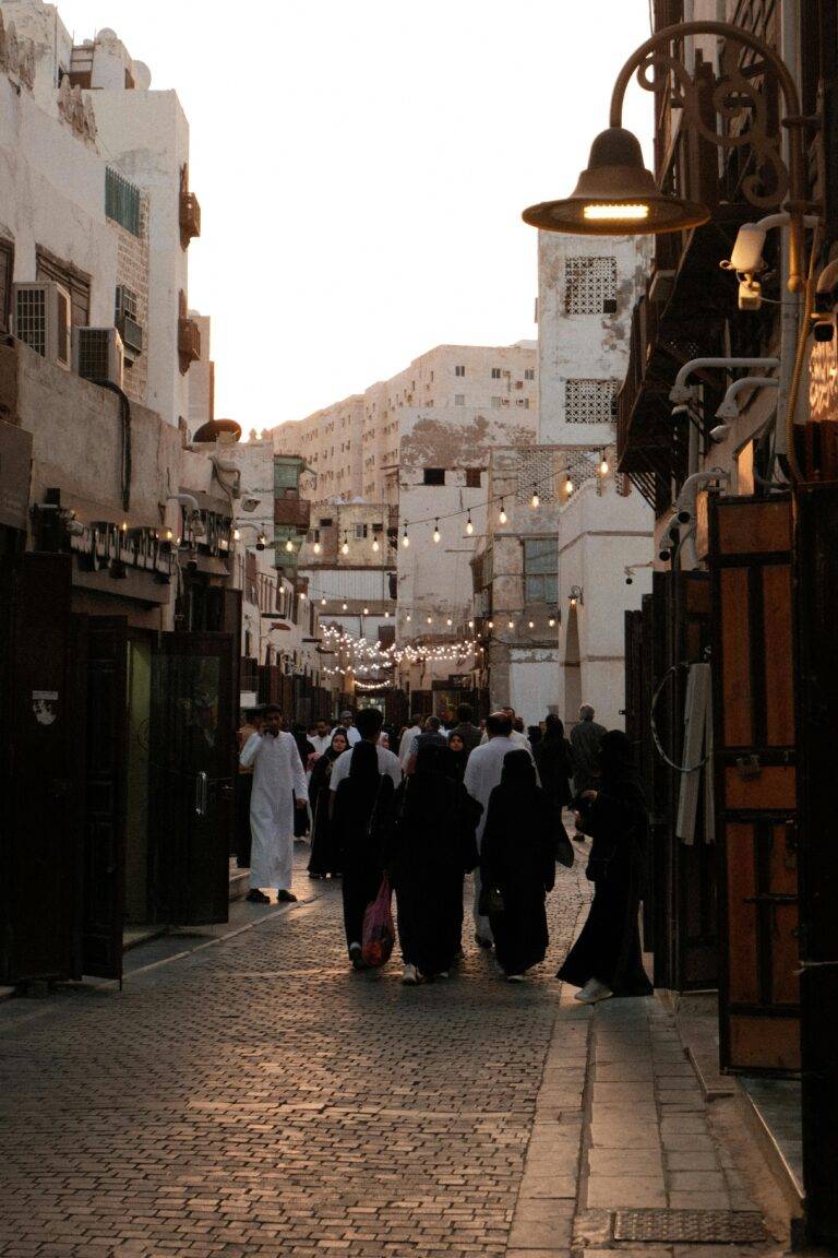 Explore the lively old town Al-Balad in Jeddah, capturing traditional Saudi architecture and culture at sunset.